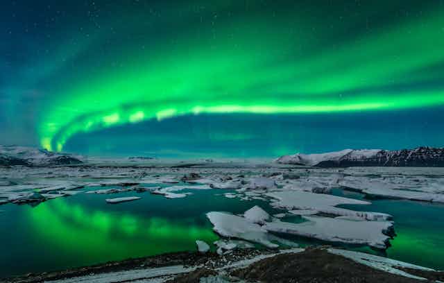 The northern lights over ice and water