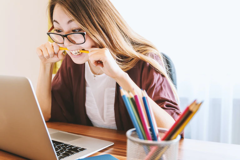 Woman getting frustrated at her laptop