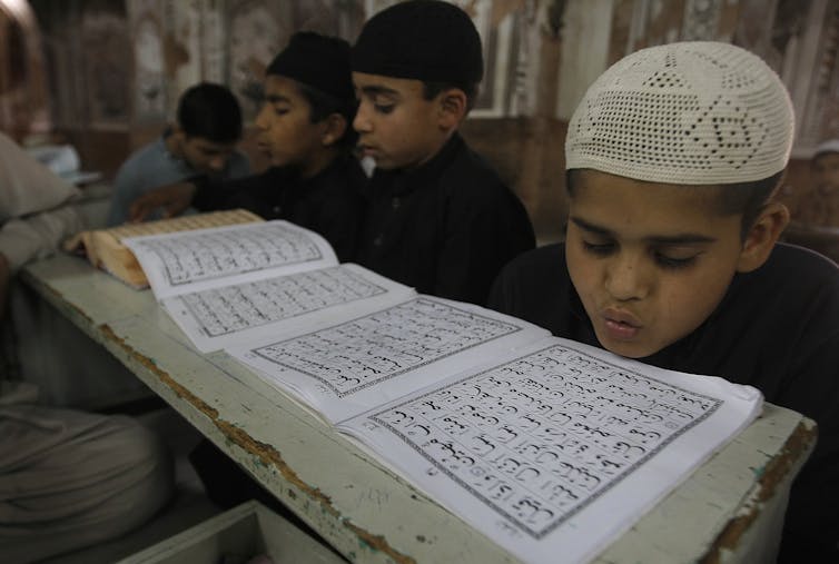 Boys study in a Madrassa in 2016