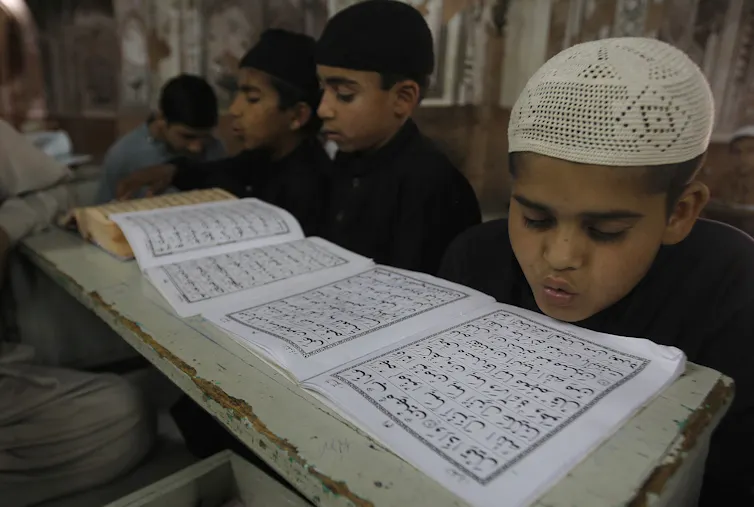 Boys study in a Madrassa in 2016