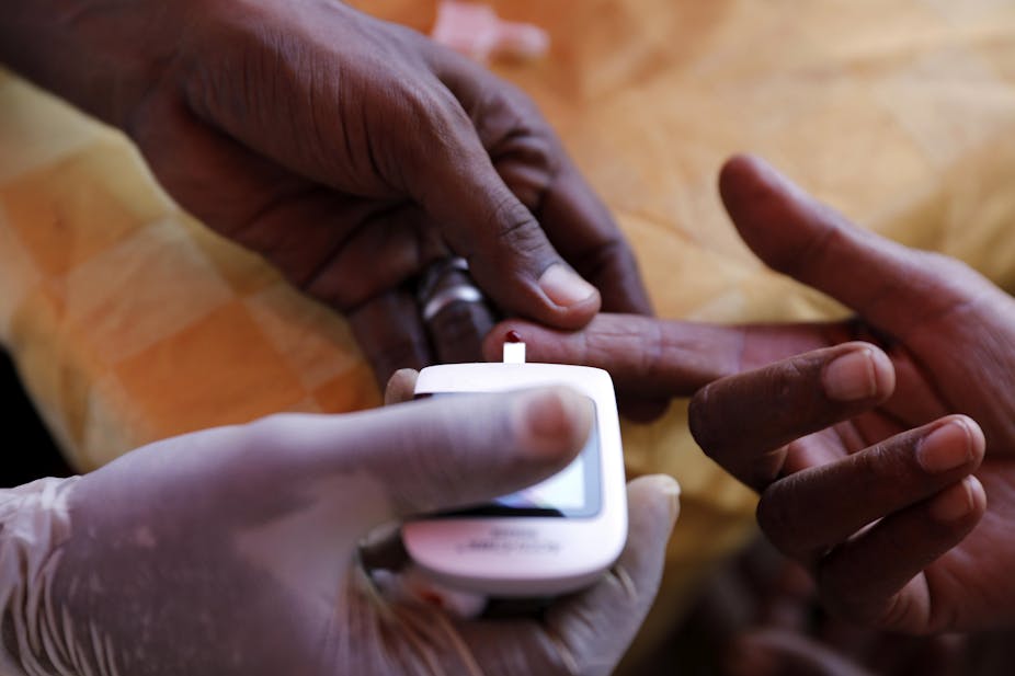 A doctor makes free blood sugar test on World Diabetes Day in Khartoum, Sudan, Nov. 14, 2019