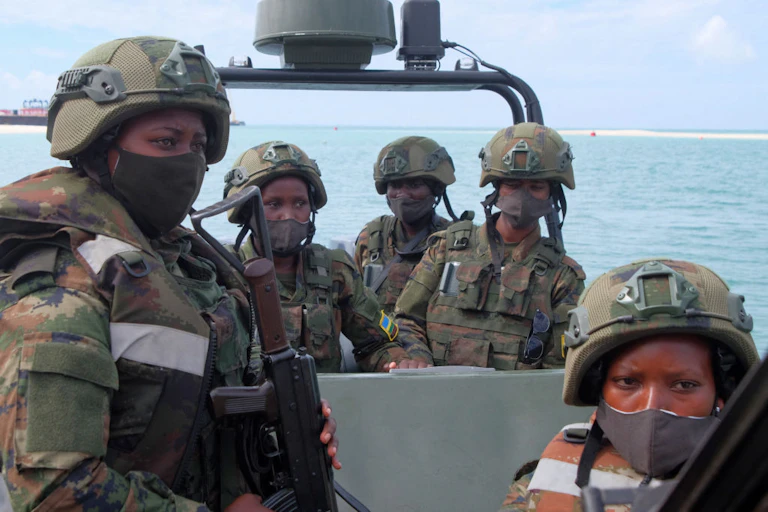 Rwandan female soldiers patrol on a boat in the port city of Mocimboa da Praia, northern Mozambique.