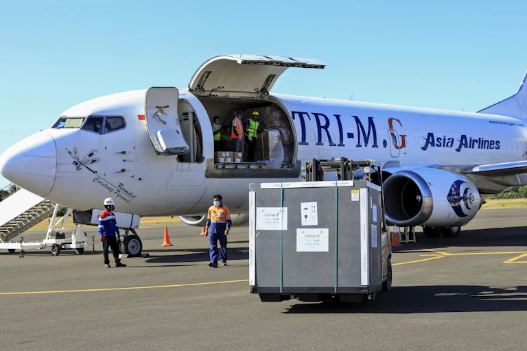 A Covax shipment being unloaded from a plane in East Timor