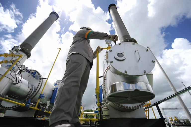 A technician works on a pipeline