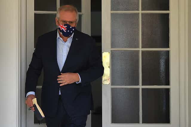 Scott Morrison, wearing a face mask with an Australia flag