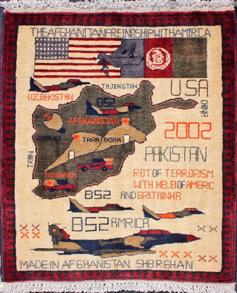 Rug featuring bomber planes and an outline of Afghanistan.