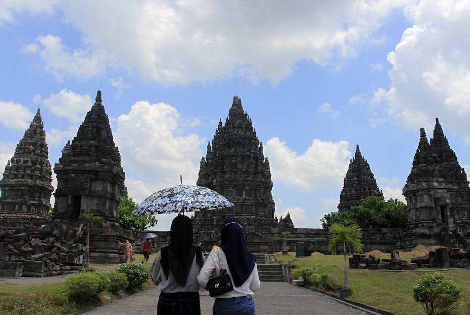 Tourists visit one of the largest Hindu temples in the world, Prambanan Temple in Yogyakarta, Sleman Regency, Indonesia, on Sept. 18, 2021. 