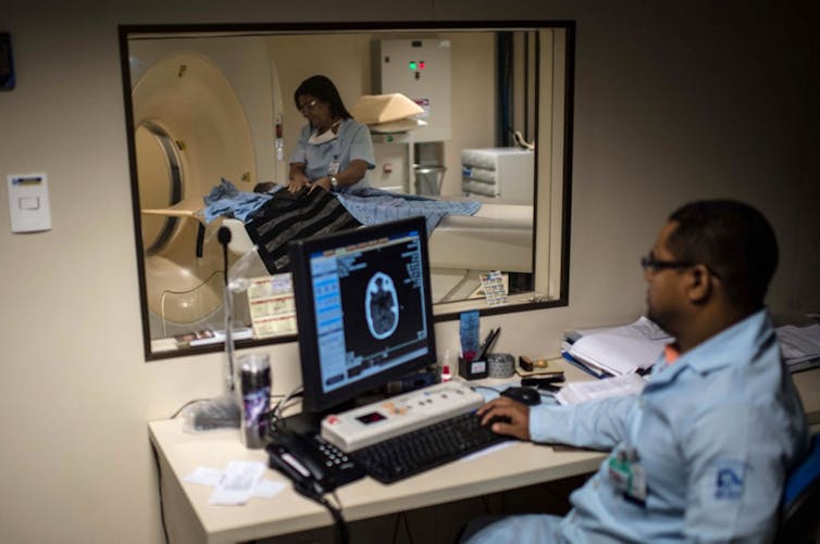 Doctors scan the brain of a newborn baby to detect for microcephaly in Salvador, Brazil -- January, 2016