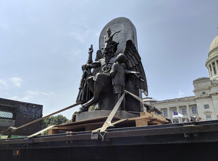 A statue of Baphomet, a winged-goat creature, installed by The Satanic Temple, a group of atheistic Satanists.