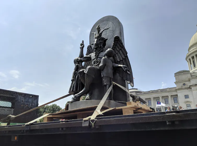 A statue of Baphomet, a winged-goat creature, installed by The Satanic Temple, a group of atheistic Satanists.