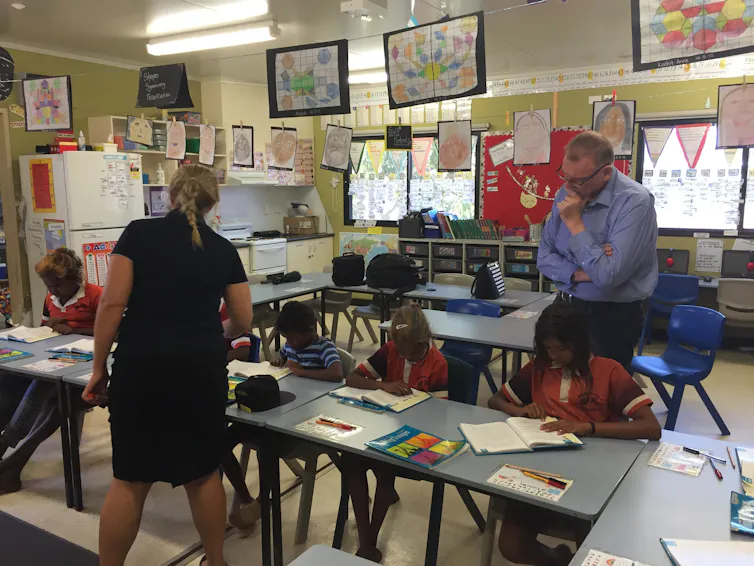 Teacher with group of nine to 11-year-olds at Borroloola primary school, Northern Territory.