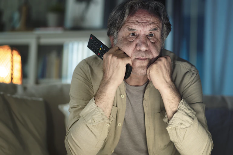A man watching TV.