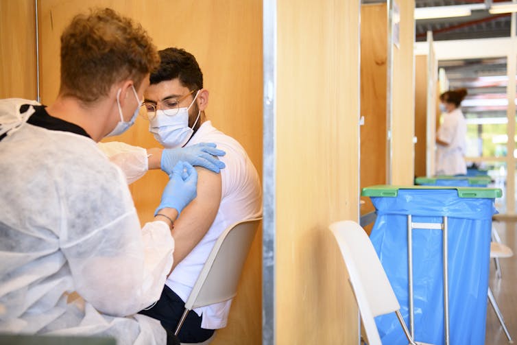 A student in France being vaccinated against COVID-19
