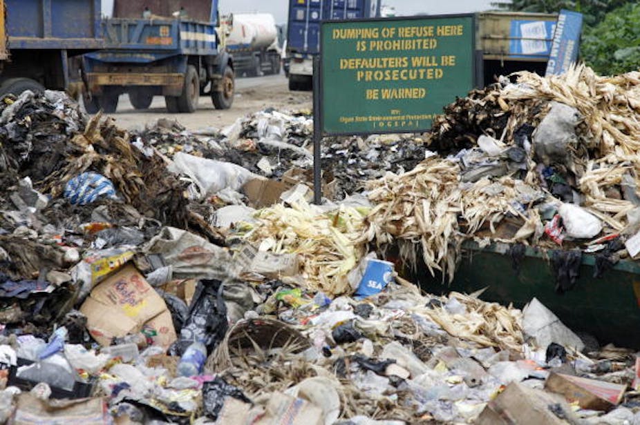 A dump site beside a street. 