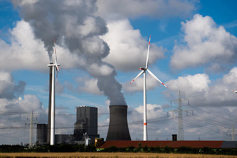 Wind turbines near a coal-fired power station.