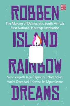 Book cover in green, blue and purple with words 'Robben Island Rainbow Dreams' and an illustration of a candle burning.