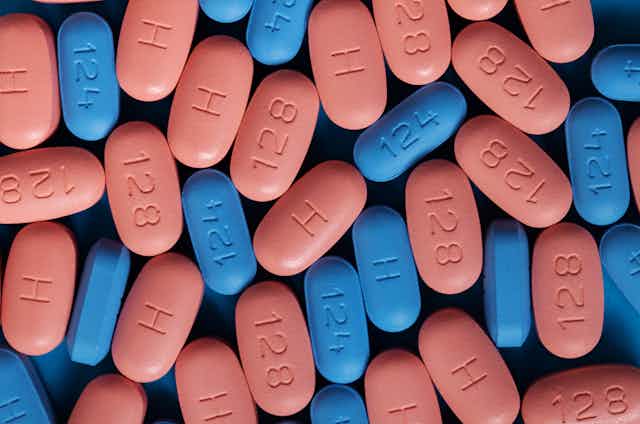 Pink and blue HIV antiretroviral pills.