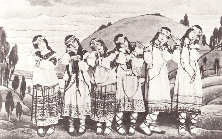 a black and white photograph of dancers