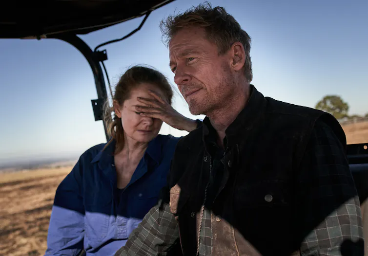 Production image: Miranda Otto and Richard Roxburgh on a tractor