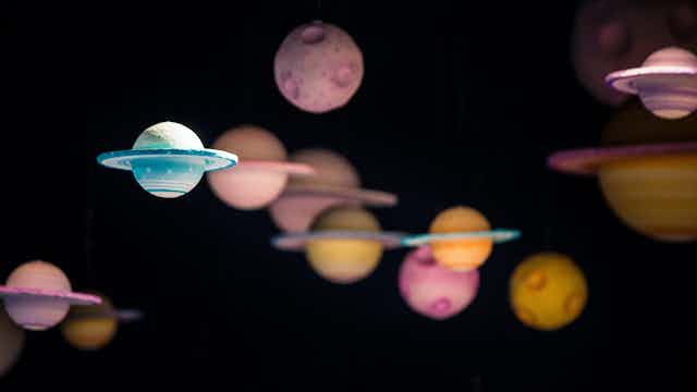 Models of planets against dark background