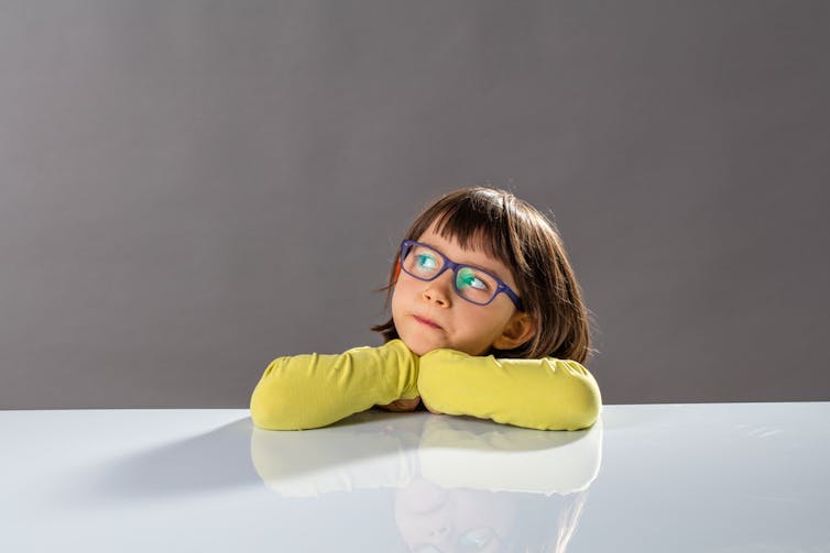 Thoughtful girl, looks up