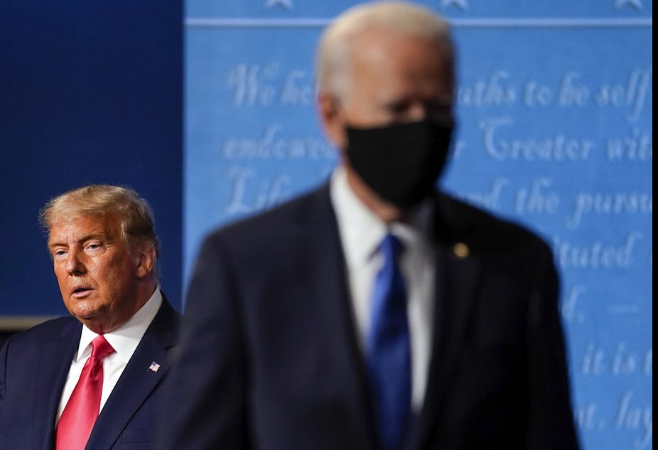 Joe Biden in the foreground, Donald Trump in the background