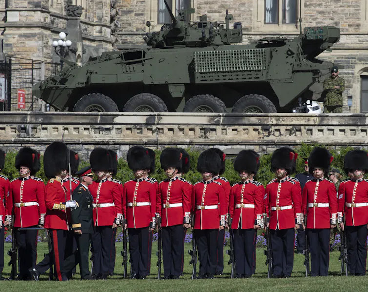 The former chief of defence staff inspects the troops