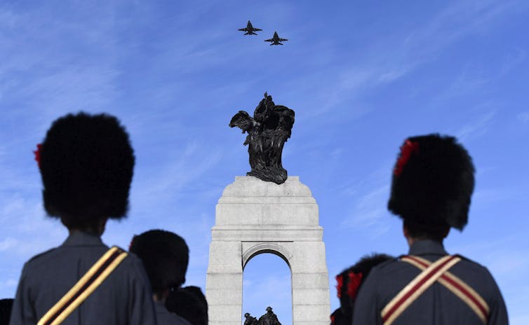 Royal Canadian Air CF-18s fly over the National War Memorial