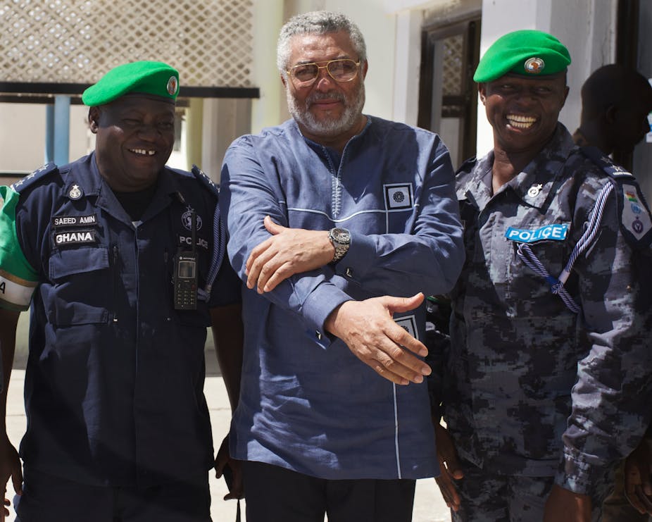Jerry Rawlings poses with peace keepers