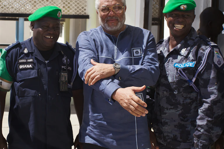 Jerry Rawlings poses with peace keepers