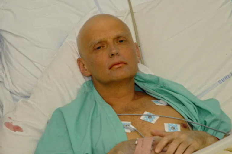 Alexander Litvinenko, a former agent of Russian intelligence, lying in a hospital bed attached to various life support machines.