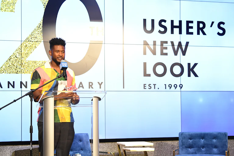 Usher speaks at an event held by his New Look foundation