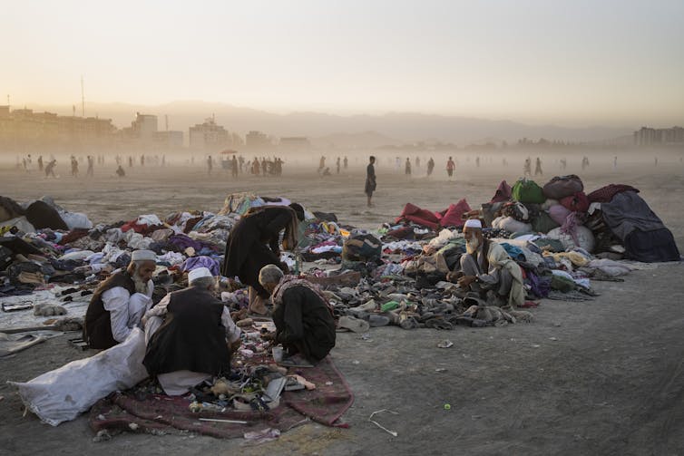 Afghans sort through second-hand clothes