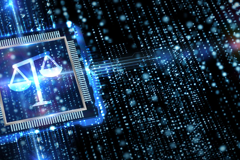 lit icon of justice scales on a circuit board