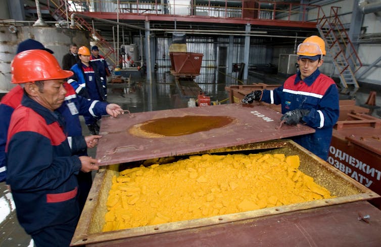 Workers in Kazakhstan processing uranium oxide.