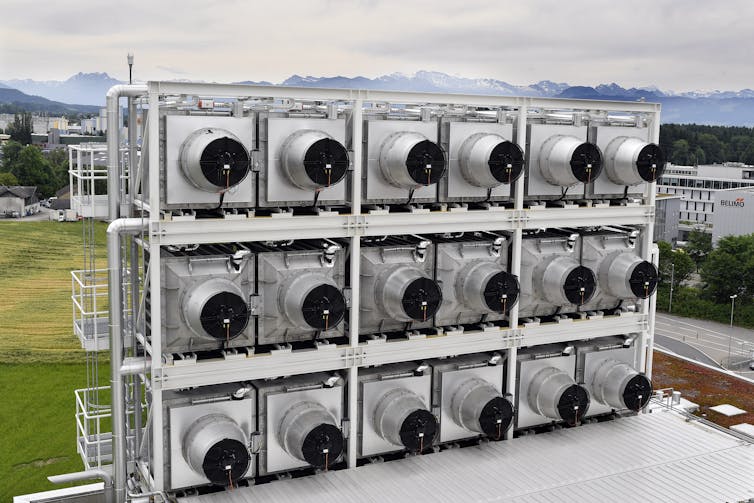 Large silver and black fan units arranged in three rows of six.