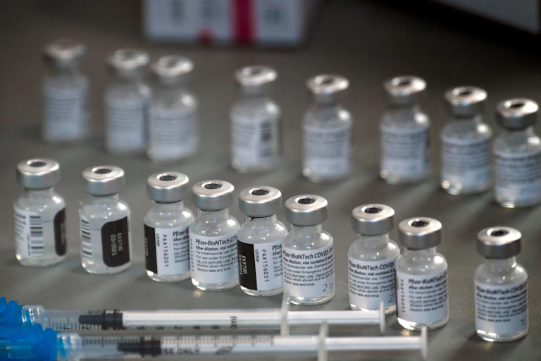 Syringes and vials of the Pfizer-BioNTech COVID-19 vaccine