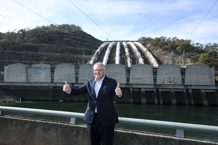 Man gives thumbs up at hydro project
