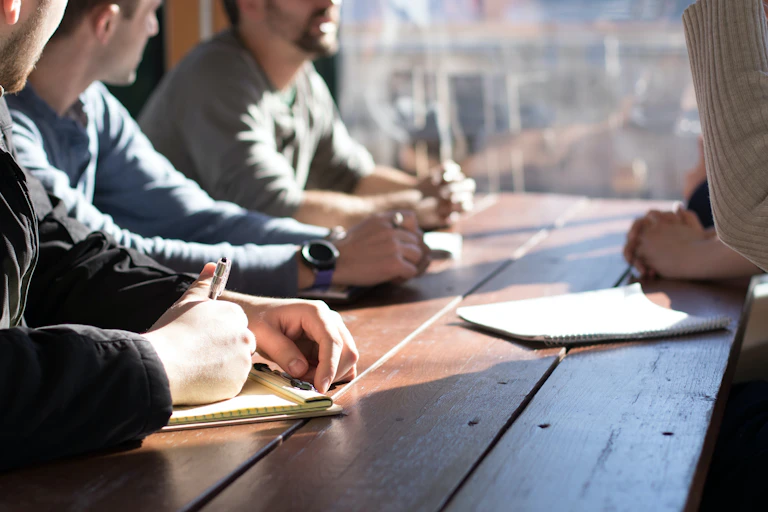Men sit together at a table.