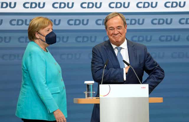 Outgoing German chancellor Angela Merkel and the man who hopes to replace her, Armin Laschet 