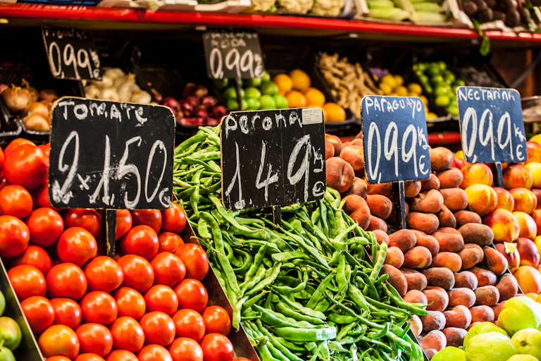 Fruit and vegetables with price signs.