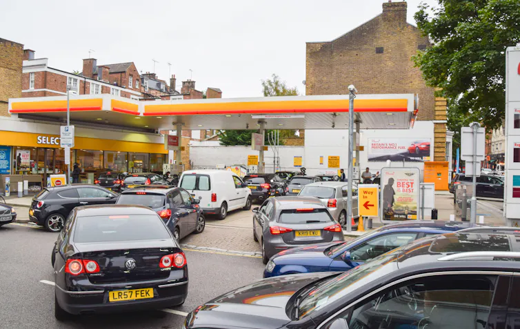 Long queues of cars waiting to pull into a Shell petrol station.