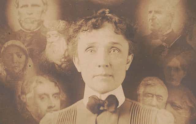 Black and white photo of a woman centre surrounded by lighter images of semi-translucent faces.