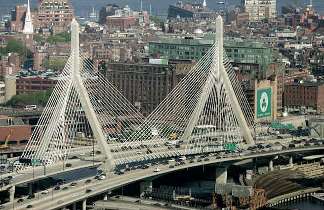 The Leonard P. Zakim Bunker Hill Bridge appears in front of the Boston skyline in this aerial photograph 