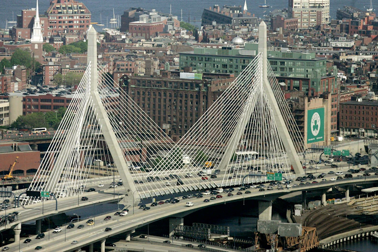The Leonard P. Zakim Bunker Hill Bridge appears in front of the Boston skyline in this aerial photograph