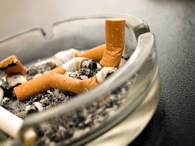 Ashtray with butted out cigarettes.