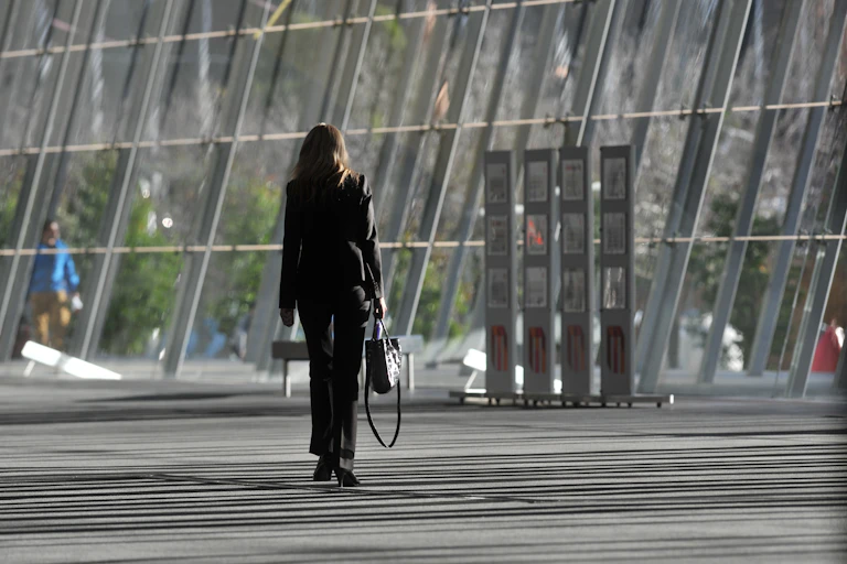 Woman in suit, with briefcase