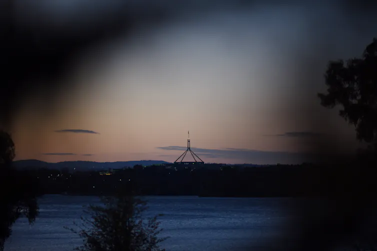 Federal parliament at sunset.