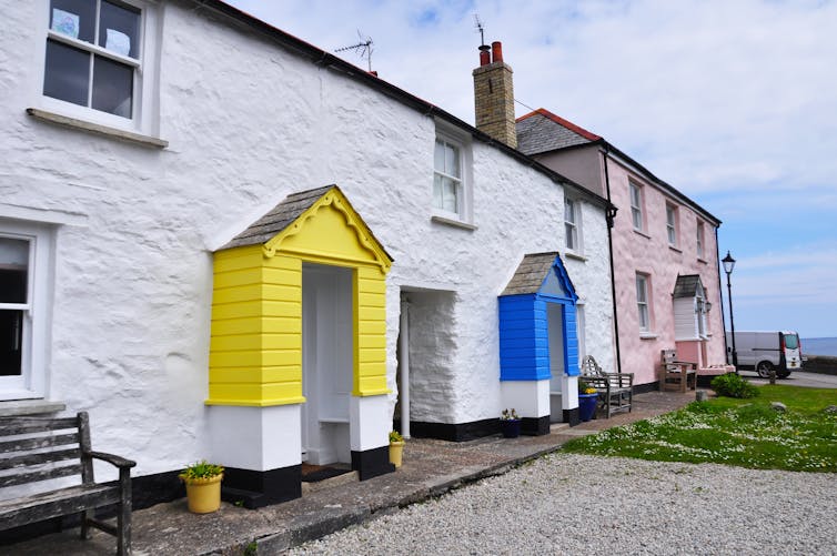 Two seaside holiday rental properties, with colourful front porches