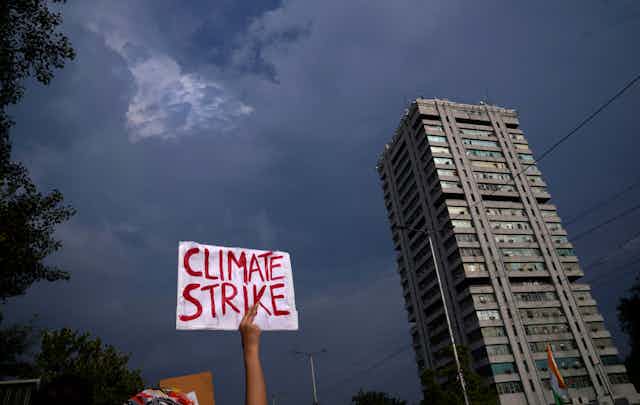 A sign reading climate strike held aloft 